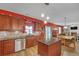Well-equipped kitchen featuring stainless steel appliances, granite counters, and a center island at 35 Kestrel Circle, Covington, GA 30014