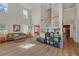 Bright, open living room with tall ceilings, hardwood floors, and lots of natural light at 35 Kestrel Circle, Covington, GA 30014