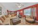 Inviting living room features a cozy sectional sofa, hardwood floors, and bright, natural light at 35 Kestrel Circle, Covington, GA 30014