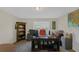 Home office featuring a large desk, shelving, and a window for natural light, ideal for productivity at 35 Kestrel Circle, Covington, GA 30014