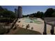 Community pool area showcasing lounge chairs, umbrellas, and a slide, perfect for summer relaxation and recreation at 35 Kestrel Circle, Covington, GA 30014