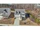 Charming two-story home with gray siding, brick accents and a well-manicured lawn at 5460 Wheeler Ridge Rd, Auburn, GA 30011