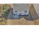 Aerial view of backyard showcasing a patio dining set and trimmed lawn at 5460 Wheeler Ridge Rd, Auburn, GA 30011