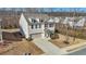 Charming two-story home with gray siding, brick accents and a two-car garage at 5460 Wheeler Ridge Rd, Auburn, GA 30011