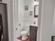 Well-appointed half-bathroom with modern vanity, toilet, and stylish decor at 5460 Wheeler Ridge Rd, Auburn, GA 30011