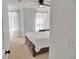 Bedroom with white bedding and large windows offering natural light at 5460 Wheeler Ridge Rd, Auburn, GA 30011