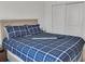 Cozy bedroom with a blue bed, large windows, and ample natural light at 5460 Wheeler Ridge Rd, Auburn, GA 30011