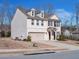 Charming two-story home with gray siding, brick accents and a two-car garage at 5460 Wheeler Ridge Rd, Auburn, GA 30011