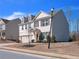 Charming two-story home with gray siding, brick accents and a well-manicured lawn at 5460 Wheeler Ridge Rd, Auburn, GA 30011