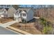 Charming two-story home with gray siding, brick accents and a well-manicured lawn at 5460 Wheeler Ridge Rd, Auburn, GA 30011