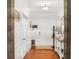 Inviting foyer with white trim, hardwood floors, and a decorative table at 5460 Wheeler Ridge Rd, Auburn, GA 30011