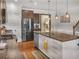 Modern kitchen featuring a large island with granite countertops and stainless steel appliances at 5460 Wheeler Ridge Rd, Auburn, GA 30011