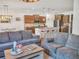 Open-concept living space featuring modern kitchen and comfortable seating area at 5460 Wheeler Ridge Rd, Auburn, GA 30011