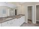 Elegant bathroom featuring double sinks, granite counters and tile flooring at 6655 Grove Meadows Ln, Cumming, GA 30028