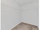 Walk-in closet with shelves for organized storage and easy access to your wardrobe at 6655 Grove Meadows Ln, Cumming, GA 30028