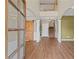 Inviting foyer featuring hardwood floors, a barn door, and a staircase at 6655 Grove Meadows Ln, Cumming, GA 30028