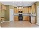 Spacious kitchen featuring granite countertops, black appliances and lots of storage at 6655 Grove Meadows Ln, Cumming, GA 30028