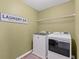 Convenient laundry room featuring a modern washer and dryer with 
