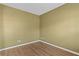 Neutral room featuring hardwood floors and ample natural light at 6655 Grove Meadows Ln, Cumming, GA 30028