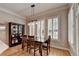 Cozy dining nook with abundant natural light from the windows at 7512 Portbury Park Ln, Suwanee, GA 30024