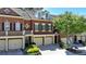 Charming townhome with well-manicured lawn, brick facade, and inviting curb appeal at 7512 Portbury Park Ln, Suwanee, GA 30024