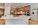 Modern kitchen featuring a large island, stainless steel appliances, and custom cabinetry with great counter space at 7512 Portbury Park Ln, Suwanee, GA 30024