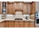 Well-equipped kitchen with stone countertops, subway tile backsplash, and stainless steel appliances at 7512 Portbury Park Ln, Suwanee, GA 30024