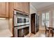 Kitchen featuring double oven and shaker style cabinets at 7512 Portbury Park Ln, Suwanee, GA 30024