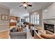 Bright and airy living room showcasing the fireplace and open floor plan at 7512 Portbury Park Ln, Suwanee, GA 30024