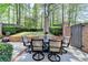 Outdoor patio with an umbrella table set perfect for entertaining at 7512 Portbury Park Ln, Suwanee, GA 30024