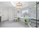 Modern bathroom with a tub, walk-in shower, decorative plants, and light gray tile at 9250 Nesbit Lakes Dr, Alpharetta, GA 30022