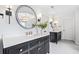 Modern bathroom featuring double vanities, stylish lighting, and sleek fixtures at 9250 Nesbit Lakes Dr, Alpharetta, GA 30022