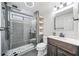 Modern bathroom featuring a glass-enclosed shower, sleek fixtures, and stylish tile work at 9250 Nesbit Lakes Dr, Alpharetta, GA 30022