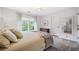 Cozy bedroom with large window, neutral color palette, plush carpeting and ample natural light at 9250 Nesbit Lakes Dr, Alpharetta, GA 30022