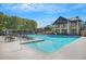 Large community pool with plenty of lounge chairs and a covered pavilion area at 9250 Nesbit Lakes Dr, Alpharetta, GA 30022