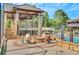 Outdoor fire pit area with Adirondack chairs next to the community pool at 9250 Nesbit Lakes Dr, Alpharetta, GA 30022