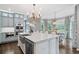 Spacious kitchen features a large island, stainless appliances, and light gray cabinetry at 9250 Nesbit Lakes Dr, Alpharetta, GA 30022