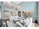 Open living room with view of kitchen, fireplace and comfortable furniture at 9250 Nesbit Lakes Dr, Alpharetta, GA 30022