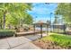Community playground with a covered picnic area and tennis courts in the background at 9250 Nesbit Lakes Dr, Alpharetta, GA 30022
