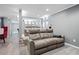 Home theater room with tiered seating, gray walls, and plush carpeting; perfect for movie nights at 9250 Nesbit Lakes Dr, Alpharetta, GA 30022