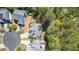 Aerial view of a landscaped home featuring a driveway, backyard, and many trees at 116 Edgeview Ct, Dallas, GA 30157