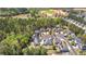 An aerial view shows a neighborhood's layout with tree-lined streets, cul-de-sacs, and proximity to nature, offering serene living at 116 Edgeview Ct, Dallas, GA 30157