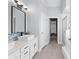 Bright bathroom with double vanity, modern fixtures, and stylish tile accents at 116 Edgeview Ct, Dallas, GA 30157