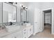 Dual sink bathroom boasts modern vanities and beautiful tile details at 116 Edgeview Ct, Dallas, GA 30157