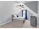 Bedroom in attic featuring sloped ceilings, neutral walls, carpet, and a window with curtains at 116 Edgeview Ct, Dallas, GA 30157