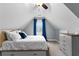 Bedroom in attic featuring sloped ceilings, neutral walls, carpet, and a window with curtains at 116 Edgeview Ct, Dallas, GA 30157