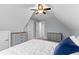 Bedroom in attic featuring sloped ceilings, neutral walls, carpet, with attached bathroom at 116 Edgeview Ct, Dallas, GA 30157