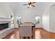 Inviting dining room with hardwood floors, modern light fixtures, and abundant natural light at 116 Edgeview Ct, Dallas, GA 30157