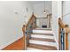 Welcoming home entryway featuring hardwood floors and an elegant staircase at 116 Edgeview Ct, Dallas, GA 30157