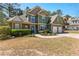 Charming two-story home featuring a two-car garage, stone accents, manicured landscaping and a walkway to the front door at 116 Edgeview Ct, Dallas, GA 30157